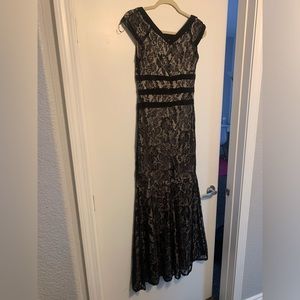 Women dress. Black with beige underneath. Used once.